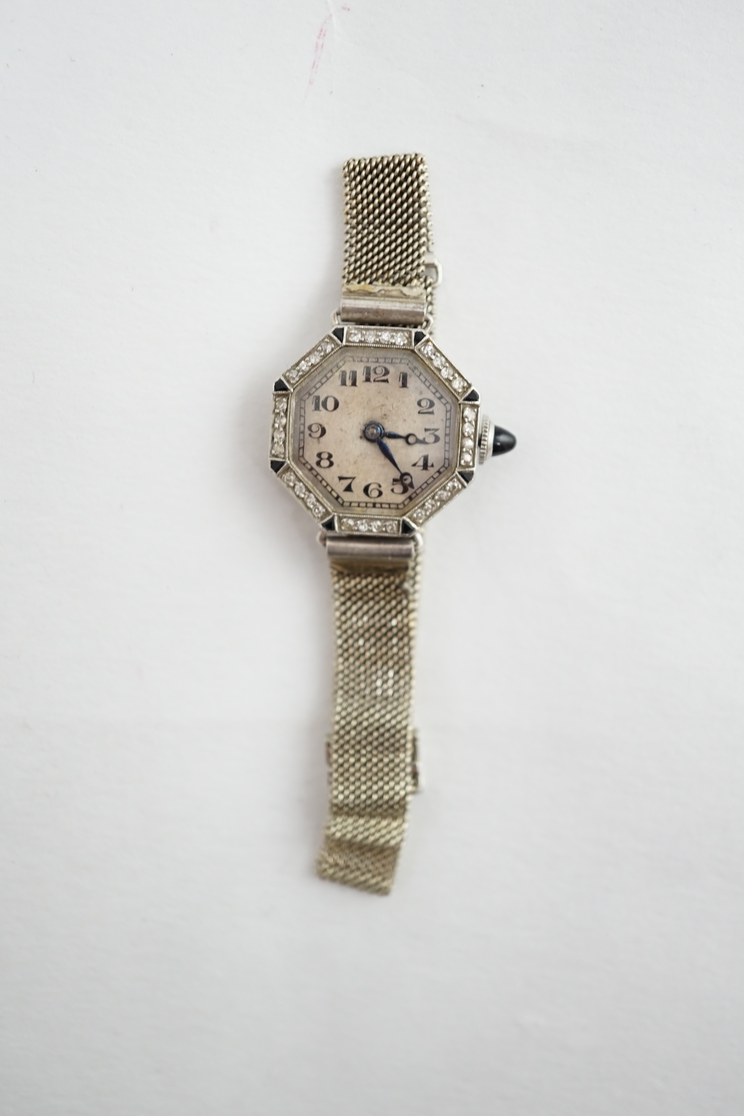 A lady's 1940's? 18ct gold, black onyx and diamond set Glycine Watch Co manual wind octagonal cocktail watch, 250